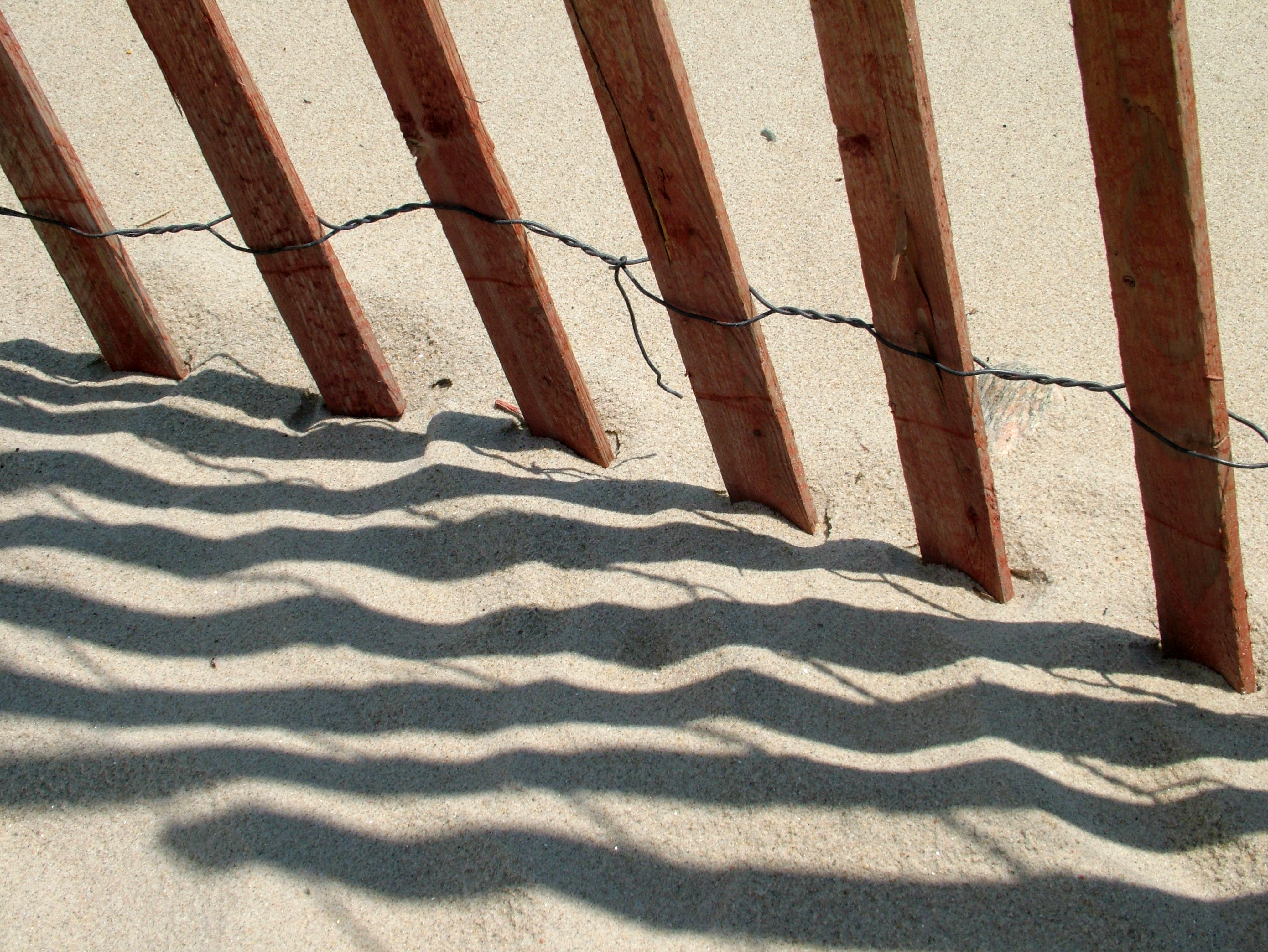 Summer fence Photo of picket fence on a sandy beach