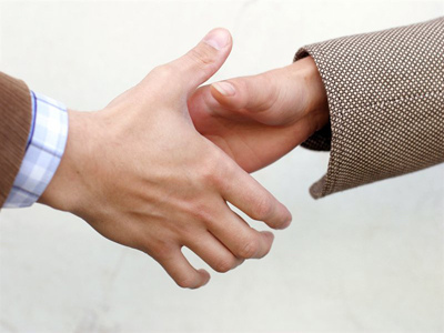 Handshake Photo of hands engaging in a handshake