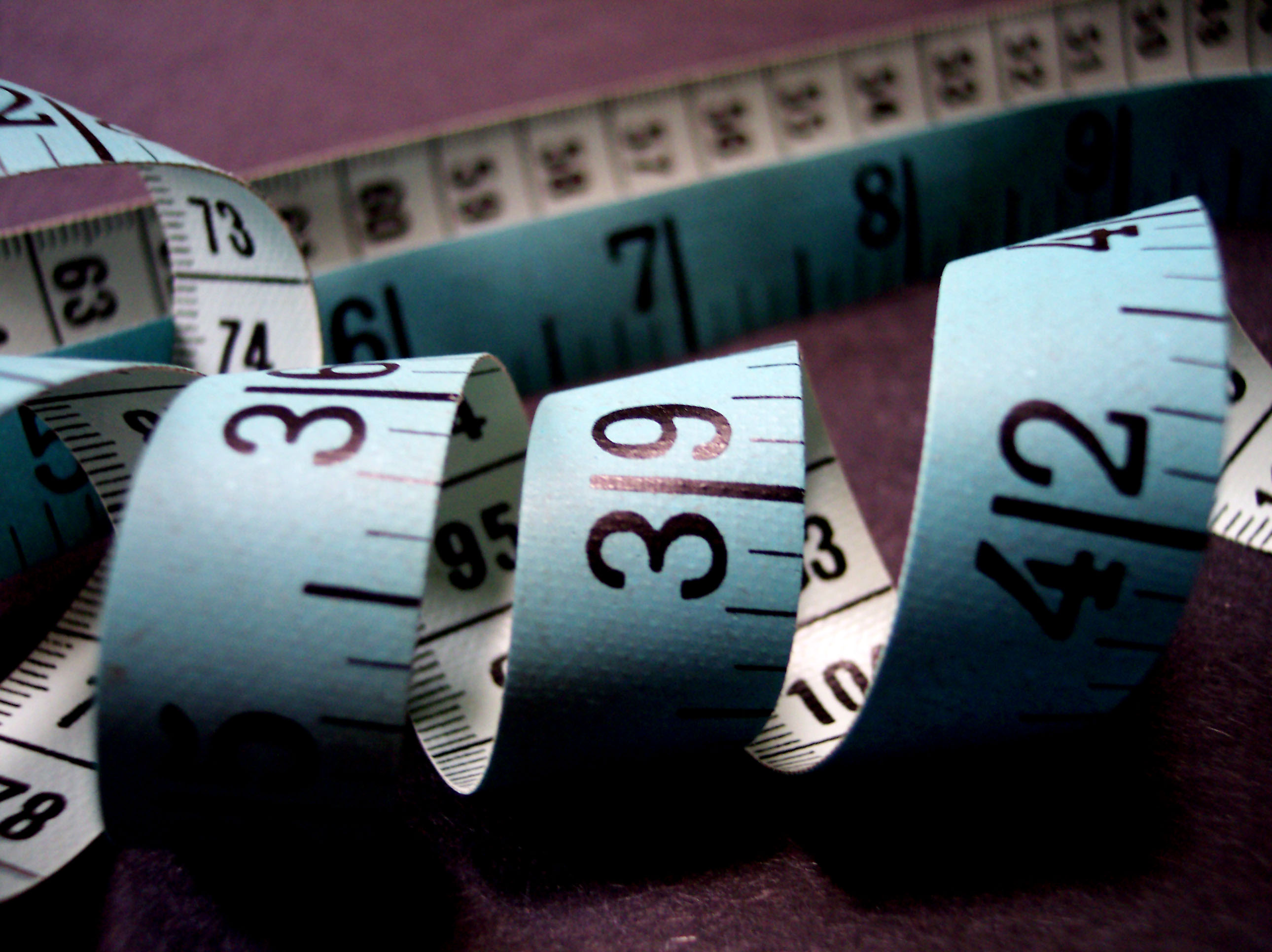 Picture of a tape measure unrolling.