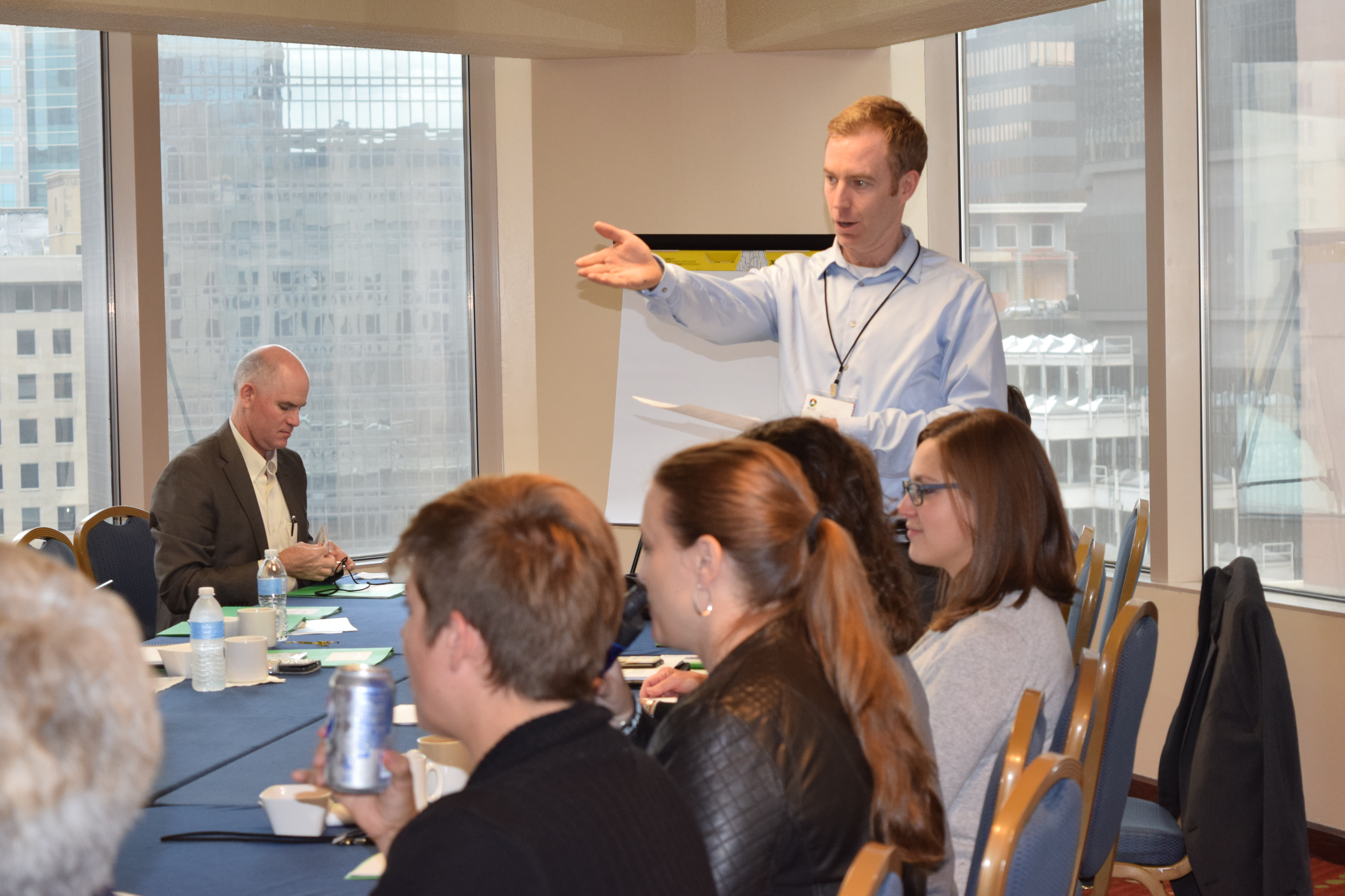 Photo of a group of people meeting in a conference room from last year's annual meeting
