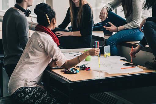 a group of students around a table