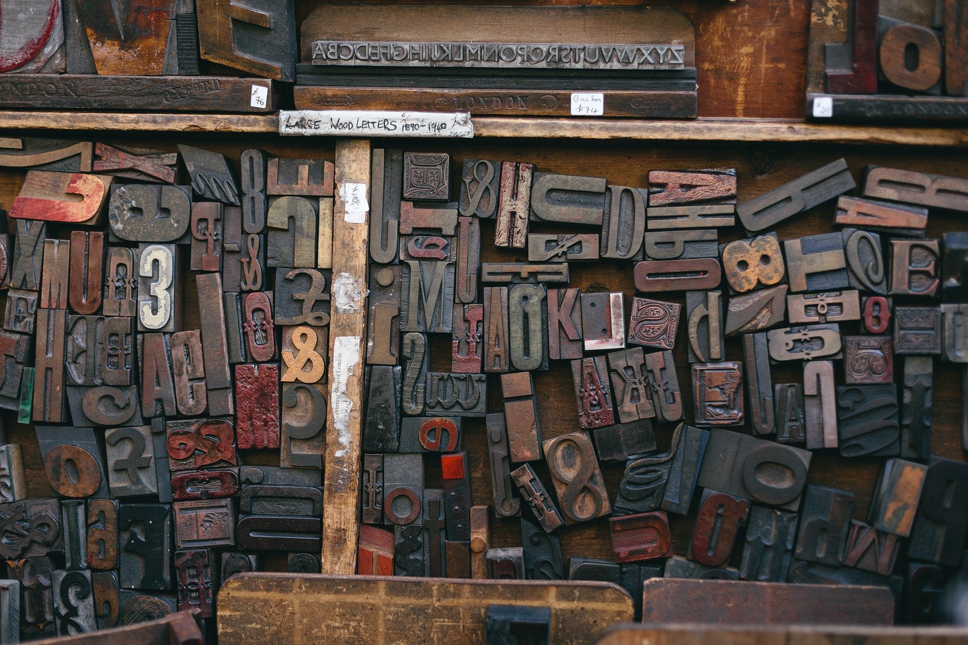 Wooden letter blocks in a drawer