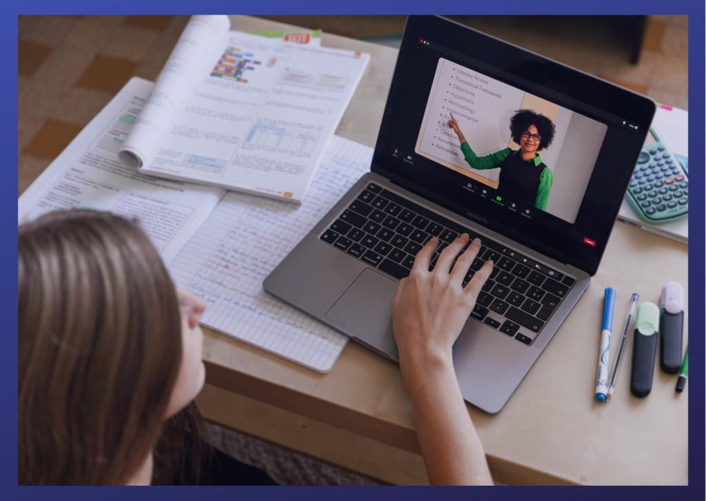 Young woman using a laptop computer and watching a course presentation
