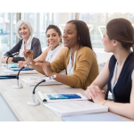 group of professional women speaking at a panel setup session