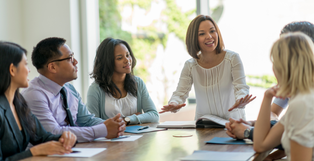 Group of professionals around a table, showing how professionals may work together to build buy-in